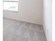 Bright bedroom features a window, neutral paint, and soft carpeting at 11510 Sweetgrass Dr, Bradenton, FL 34212
