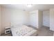 Bright bedroom features neutral walls, a large closet, and an adjacent door at 11510 Sweetgrass Dr, Bradenton, FL 34212