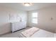 Charming bedroom with a dresser, a window, and whimsical decor at 11510 Sweetgrass Dr, Bradenton, FL 34212