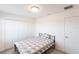 Bright bedroom features neutral walls, a large closet, and an adjacent door at 11510 Sweetgrass Dr, Bradenton, FL 34212