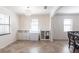 Bright dining area with custom cabinets, shelving and flooring, plus stylish chandelier at 11510 Sweetgrass Dr, Bradenton, FL 34212