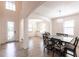 View of dining area, featuring modern chandelier, dining table, and elegant archways at 11510 Sweetgrass Dr, Bradenton, FL 34212