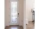 Elegant foyer featuring a decorative glass door and tile flooring, offering a bright welcome at 11510 Sweetgrass Dr, Bradenton, FL 34212