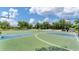 Outdoor basketball court with multiple hoops and benches for relaxing at 11702 Anhinga Avenue, Venice, FL 34292