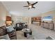 Open-concept living area with comfortable seating, access to the kitchen and dining area at 11702 Anhinga Avenue, Venice, FL 34292