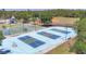 Aerial view of sports courts with basketball and pickleball courts at the community at 11702 Anhinga Avenue, Venice, FL 34292