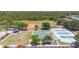 Aerial view of community sports courts, playground, and grassy field at 11702 Anhinga Avenue, Venice, FL 34292