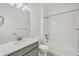 Clean, well-lit bathroom with modern fixtures, white subway tile, and a gray vanity at 14265 17Th E Ct, Parrish, FL 34219