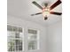 Bedroom features a modern ceiling fan and bright natural light streaming through the windows at 14265 17Th E Ct, Parrish, FL 34219
