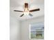 Bedroom features a modern ceiling fan and bright natural light streaming through the window at 14265 17Th E Ct, Parrish, FL 34219