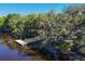 Aerial shot highlighting a private boat launch and dock that will facilitate water recreation at 14265 17Th E Ct, Parrish, FL 34219