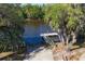 Aerial shot highlighting a private boat launch and dock that will facilitate water recreation at 14265 17Th E Ct, Parrish, FL 34219