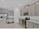 Kitchen features stainless steel appliances, generous counter space, and a convenient island at 14265 17Th E Ct, Parrish, FL 34219