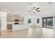 Open kitchen featuring stainless steel appliances, stone countertops, pendant lighting, and tile flooring at 14265 17Th E Ct, Parrish, FL 34219