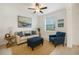 Cozy living room with stylish furnishings, neutral tones, and ample natural light at 14265 17Th E Ct, Parrish, FL 34219