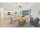 Bright and airy living room featuring an open floor plan and access to the outdoor area at 14265 17Th E Ct, Parrish, FL 34219