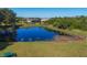 Picturesque pond in the community with lush greenery, providing a serene and relaxing atmosphere at 14265 17Th E Ct, Parrish, FL 34219