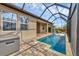 Enjoy a serene pool view from the patio with a hot tub and beautiful landscaping at 14265 17Th E Ct, Parrish, FL 34219