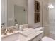 Modern bathroom with granite countertops, glass shower, and decorative accents at 14907 Contenta Loop, Bradenton, FL 34211