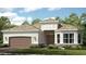 Charming single-story home with a 2-car garage, manicured lawn, and beautiful stone accents at 14907 Contenta Loop, Bradenton, FL 34211