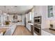 Well-equipped kitchen featuring an island, stainless steel appliances, and elegant white cabinetry at 14907 Contenta Loop, Bradenton, FL 34211