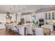 Bright kitchen with a large center island, stainless steel appliances, and stylish pendant lighting at 14907 Contenta Loop, Bradenton, FL 34211