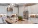 Gourmet kitchen featuring stainless steel appliances, a large island, and stylish countertops at 14907 Contenta Loop, Bradenton, FL 34211