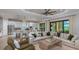 Open-concept living area flowing into the gourmet kitchen and featuring access to the outdoor space at 14907 Contenta Loop, Bradenton, FL 34211