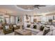 Spacious living room with modern decor, seamlessly connected to a gourmet kitchen at 14907 Contenta Loop, Bradenton, FL 34211