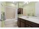 Well-lit bathroom with modern fixtures and a shower and bath at 1520 Dorgali Dr, Sarasota, FL 34238