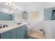Bright bathroom featuring a double vanity with granite countertop and walk-in shower at 1520 Dorgali Dr, Sarasota, FL 34238