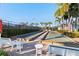 View of a community bocce ball court with benches and tables next to the play area at 1520 Dorgali Dr, Sarasota, FL 34238