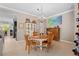 Inviting dining room with a chandelier, neutral colors, and views into the kitchen at 1520 Dorgali Dr, Sarasota, FL 34238