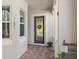 Charming front entry featuring a decorative glass door, brick floor, and inviting decor at 1520 Dorgali Dr, Sarasota, FL 34238