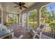 Relaxing front porch with rocking chairs, brick flooring, and serene views of the neighborhood at 1520 Dorgali Dr, Sarasota, FL 34238