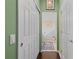 Hallway with multiple closets and a decorative runner at 1520 Dorgali Dr, Sarasota, FL 34238