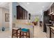 Modern kitchen with stainless steel appliances, granite countertops, and a breakfast bar at 1520 Dorgali Dr, Sarasota, FL 34238