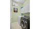 Functional laundry room with modern washer and dryer at 1520 Dorgali Dr, Sarasota, FL 34238