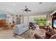 Spacious living room with natural light, comfortable seating, and access to the outdoor area at 1520 Dorgali Dr, Sarasota, FL 34238