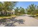 Peaceful neighborhood street lined with mature trees and well-maintained homes at 1520 Dorgali Dr, Sarasota, FL 34238