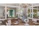 Elegant dining room with modern chandelier, mirrored wall, and seating for six, perfect for entertaining at 15408 San Lazzaro Ave, Bradenton, FL 34211