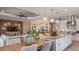 Open-concept design seamlessly connects the living room, dining area, and modern kitchen at 15408 San Lazzaro Ave, Bradenton, FL 34211