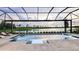 Stunning screened-in pool and spa with picturesque views of the golf course and water at 15408 San Lazzaro Ave, Bradenton, FL 34211