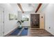 Bright bonus room with a wooden sauna, yoga mats, wood-look floors, and beamed ceiling at 1724 Cheyenne St, Sarasota, FL 34231