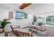 Bright and airy living room with a comfortable seating area, modern decor, and views of the pool area at 1724 Cheyenne St, Sarasota, FL 34231