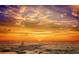 Sunset over the ocean creates a picturesque scene, with colorful skies reflected on the water, for a tranquil and relaxing view at 1724 Cheyenne St, Sarasota, FL 34231