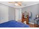 Cozy bedroom with hardwood floors, ceiling fan and classic wood dresser at 1788 Palm View Rd, Sarasota, FL 34240