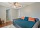 Inviting guest room with a cozy daybed, wood floors, and ensuite bathroom access at 1788 Palm View Rd, Sarasota, FL 34240