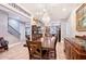 Elegant dining room with an exquisite chandelier and ample space, perfect for formal gatherings at 1788 Palm View Rd, Sarasota, FL 34240