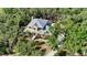 Charming yellow home nestled among mature trees and meticulous landscaping at 1788 Palm View Rd, Sarasota, FL 34240